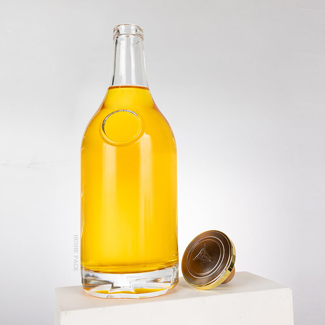 Bouteille d'alcool en verre bulbeux arrondi