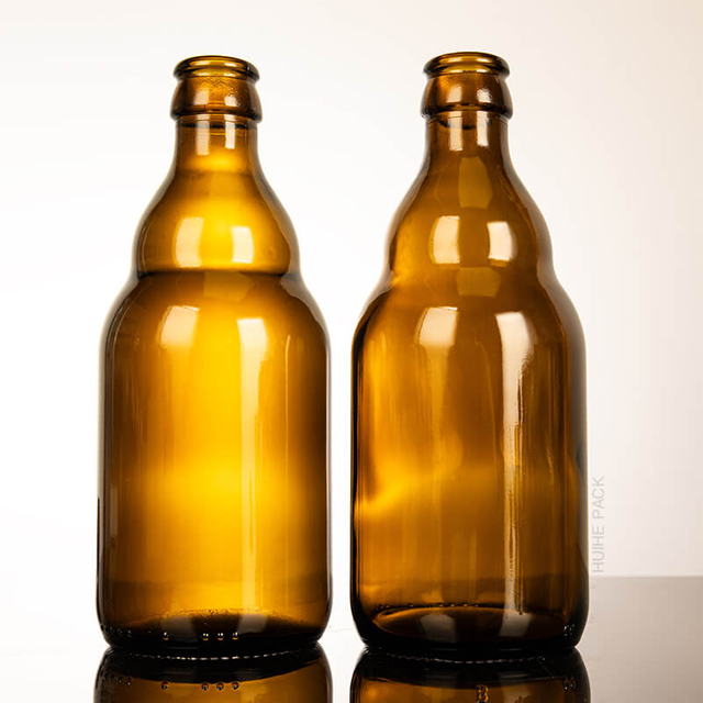 En stock, bouteille de bière en verre vide ambrée avec bonnet de couronne