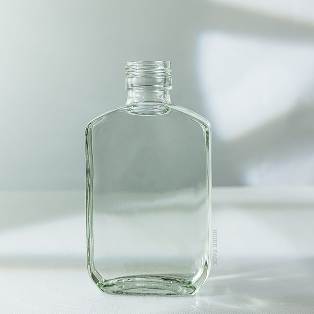 Bouteille de boisson en verre de flacon de 110 ml avec bouchon à vis en gros