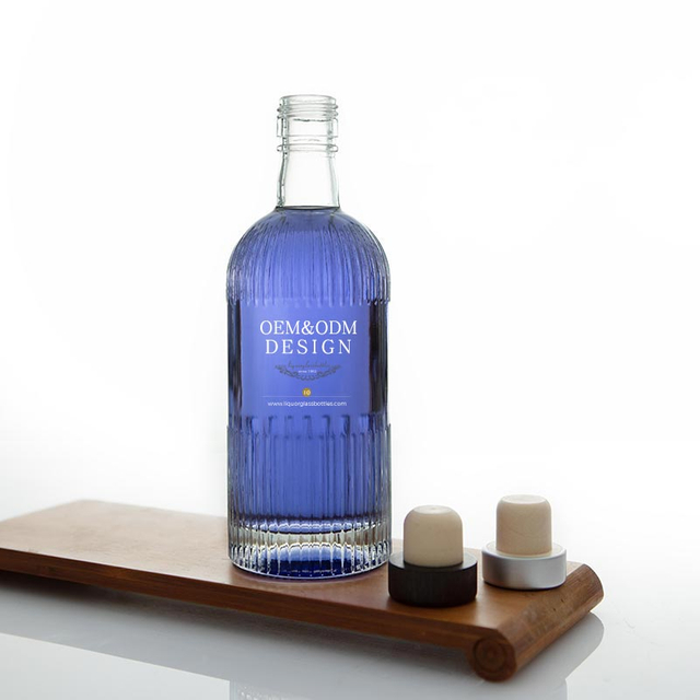 Bouteille de liqueur en verre rayé rond à finition à vis