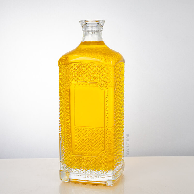 Bouteille d'alcool en verre carré en relief de 1000 ml