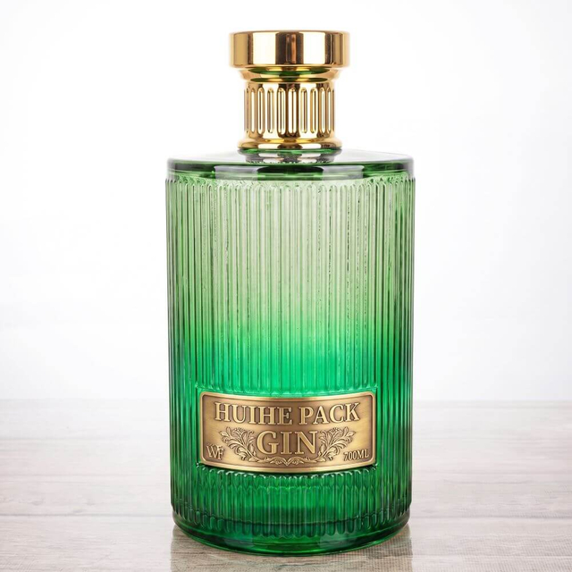 Bouteille d'alcool &agrave; cylindre c&ocirc;tel&eacute; vertical avec bouchons &agrave; vis