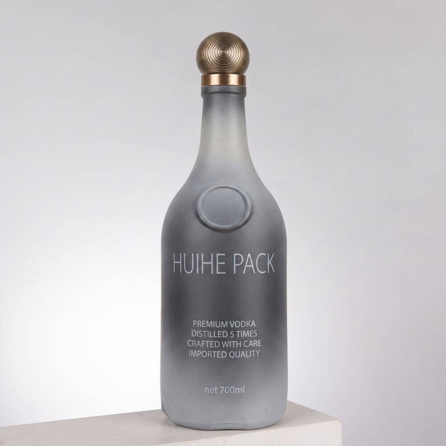 Bouteille d'alcool en verre bulbeux arrondi